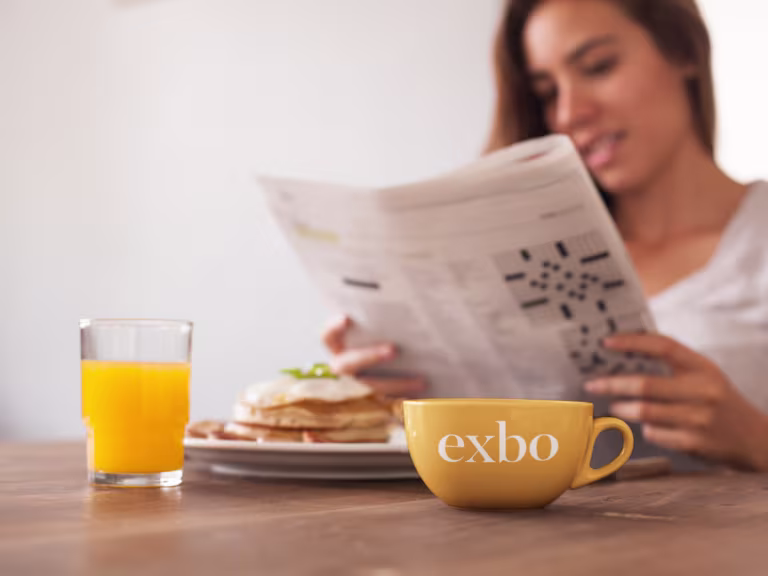 cup-mockup-of-a-girl-reading-the-newspaper-while-having-breakfast-a7033-768x576